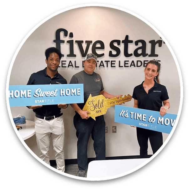 caleb-and-ryan-with-client-in-front-of-house caleb-and-ryan-with-client-in-front-of-house