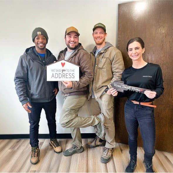 Caleb Reits and Ryann Brier of City Lights Home Buyers with clients in Michigan