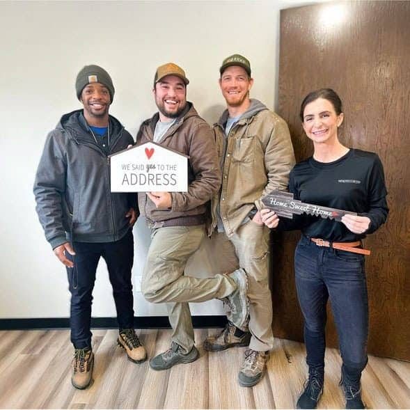 Caleb Reits and Ryann Brier of City Lights Home Buyers with clients in Michigan